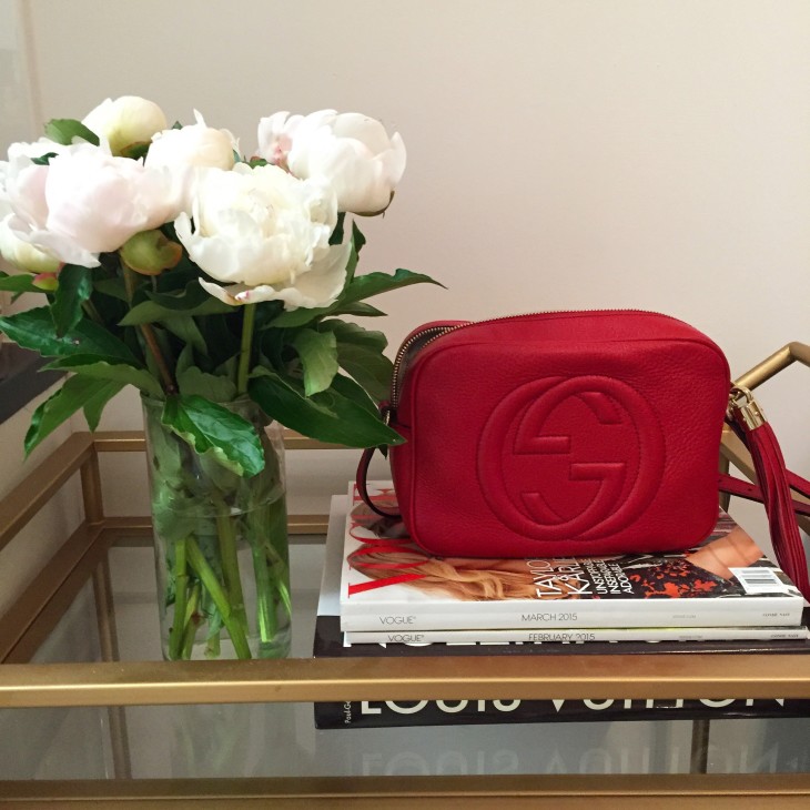 red gucci soho bag and peonies